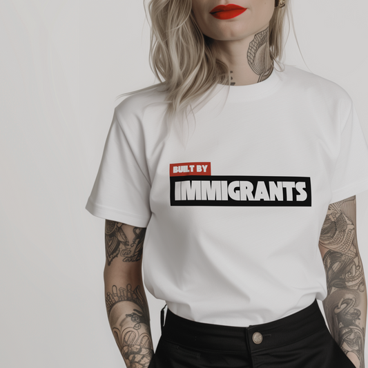 a white pro-immigration t-shirt with 'Built by Immigrants' in bold font