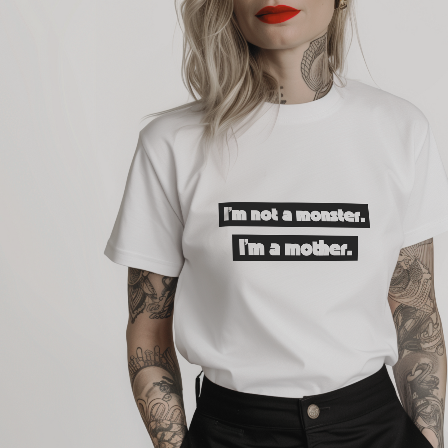 Women’s minimalist white t-shirt with the quote ' I'm not a monster. I'm a mother.' in a simple design and white color.