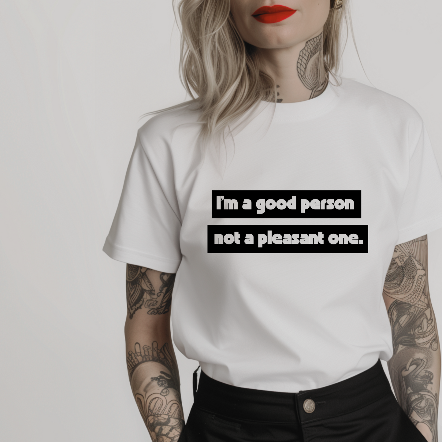 Women’s minimalist t-shirt with the quote 'I’m a good person not a pleasant one.' in a simple design and white color.