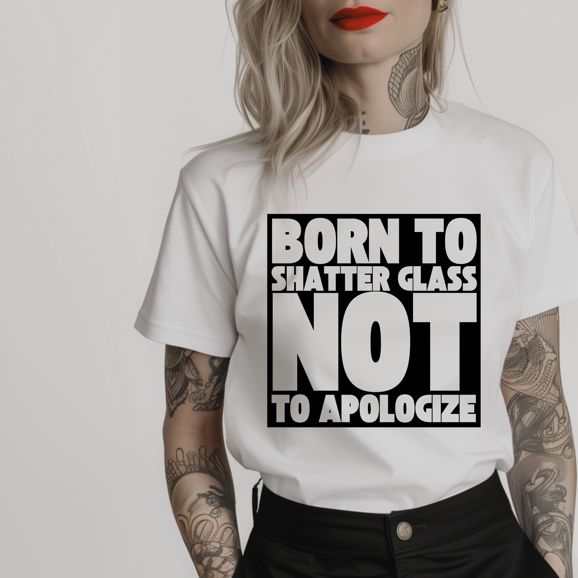 Women’s minimalist t-shirt with the quote 'Born to shatter glass not to apologize' in a simple design and white color.