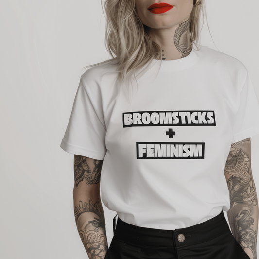 Women’s minimalist t-shirt with the quote 'BROOMSTICKS + FEMINISM' in a simple design and white color.