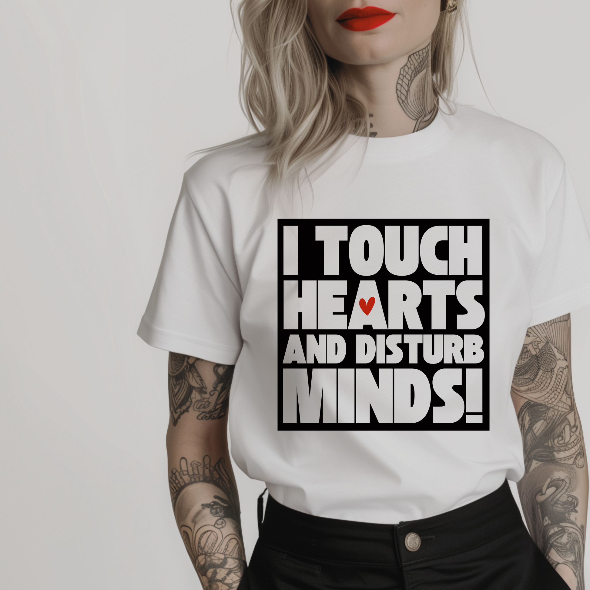 Women’s minimalist t-shirt with the quote 'I touch hearts and disturb minds!' in a simple design and white color.