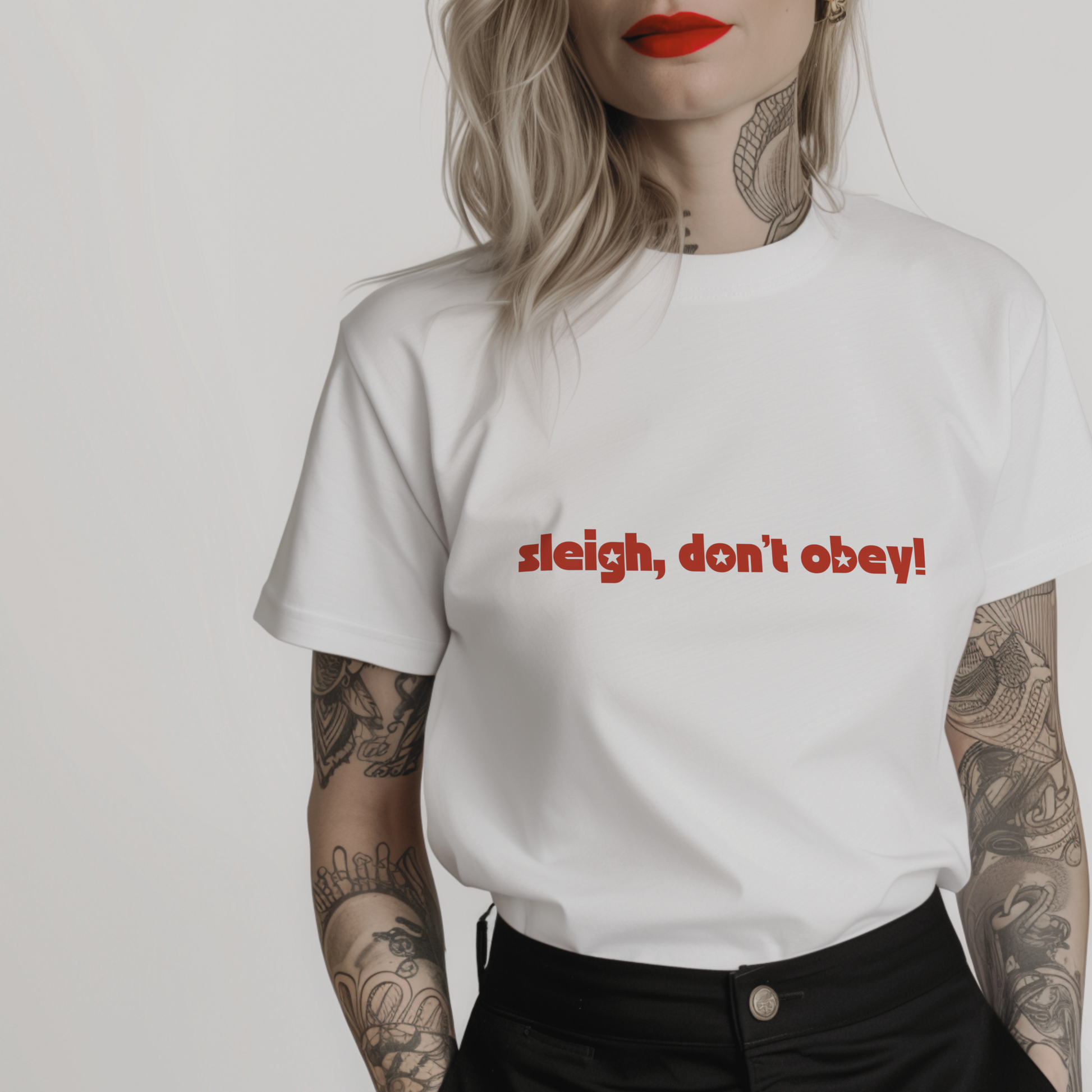 white feminist christmas t-shirt with 'sleigh, don't obey!' in red font