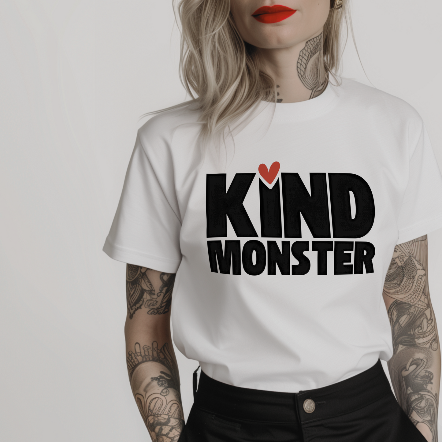 Women’s minimalist t-shirt with the quote 'KIND MONSTER' in a simple design and white color