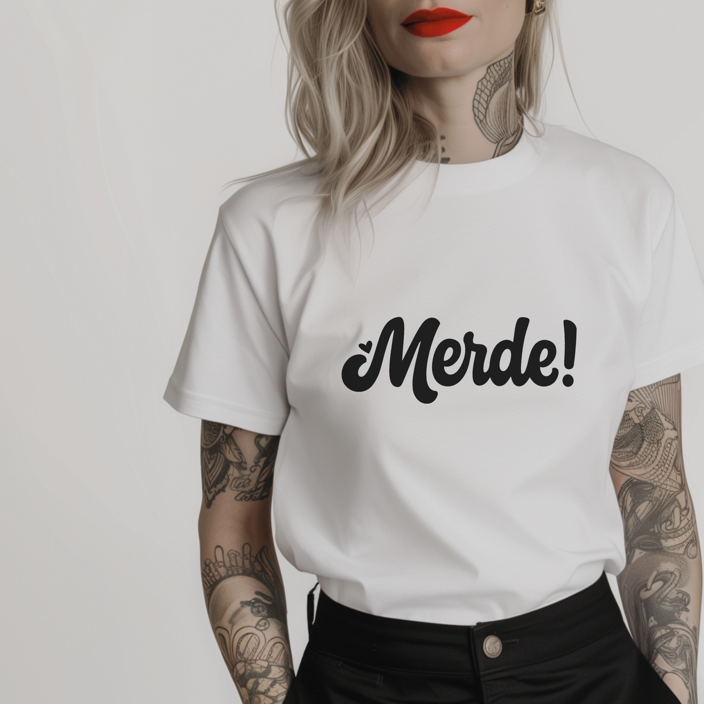 combed cotton white minimalist t-shirt with 'Merde!' text written in a vintage decorative font on a white background