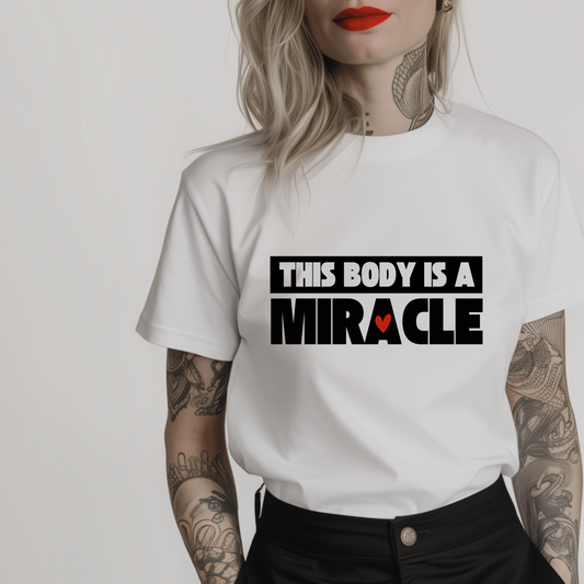 Women’s minimalist t-shirt with the quote 'This body is a miracle.' in a simple design and white color.