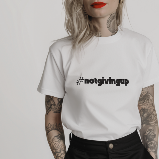 Women’s minimalist t-shirt with the quote 'notgivingup' in a simple design and white color.