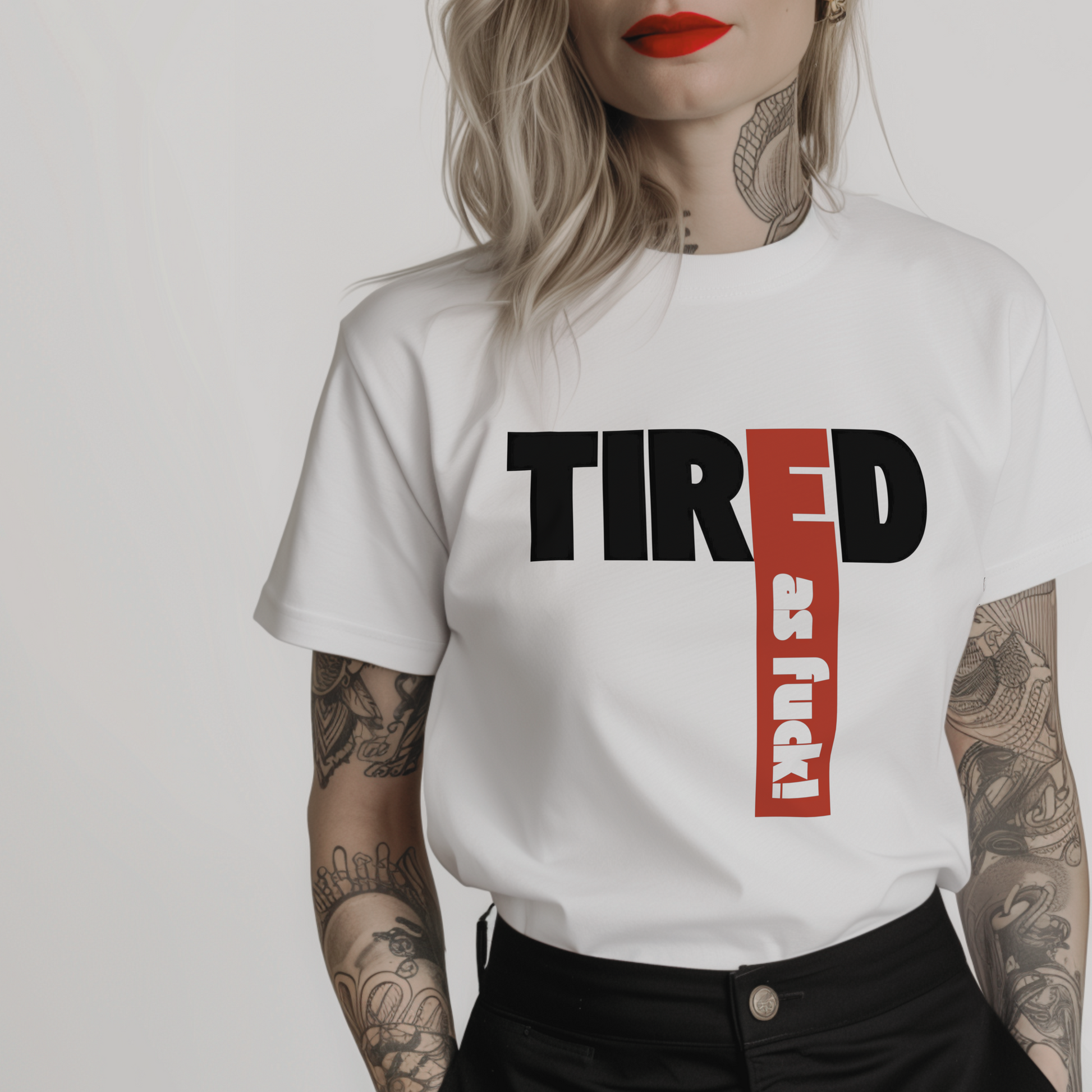 white tshirt for exhausted women with "Tired as fuck!" printed in bold black and red font